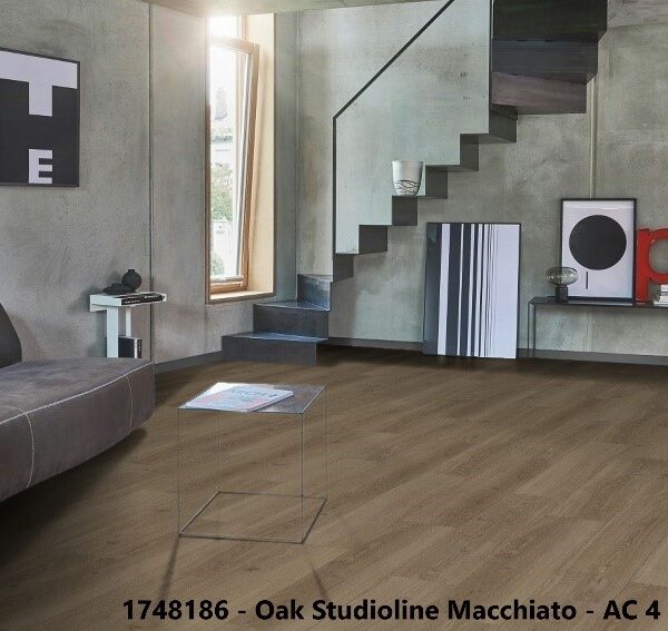 Parador Oak Studioline Macchiato German laminate flooring installed in a modern Karachi living room